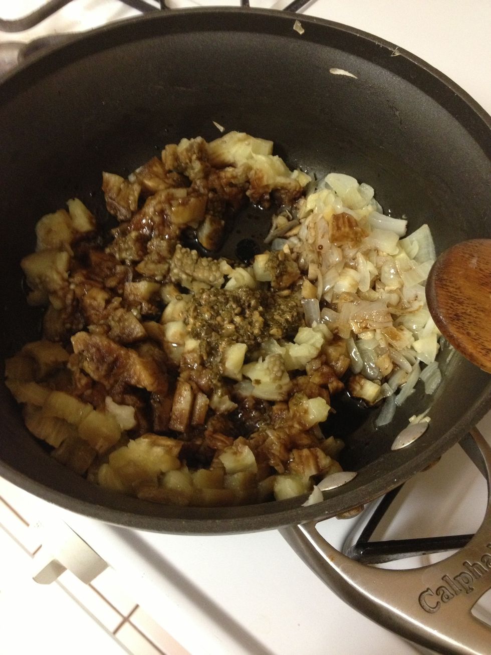 Combine eggplant, pesto, evoo, vinegar to taste, and saut\u00e9ed mixture