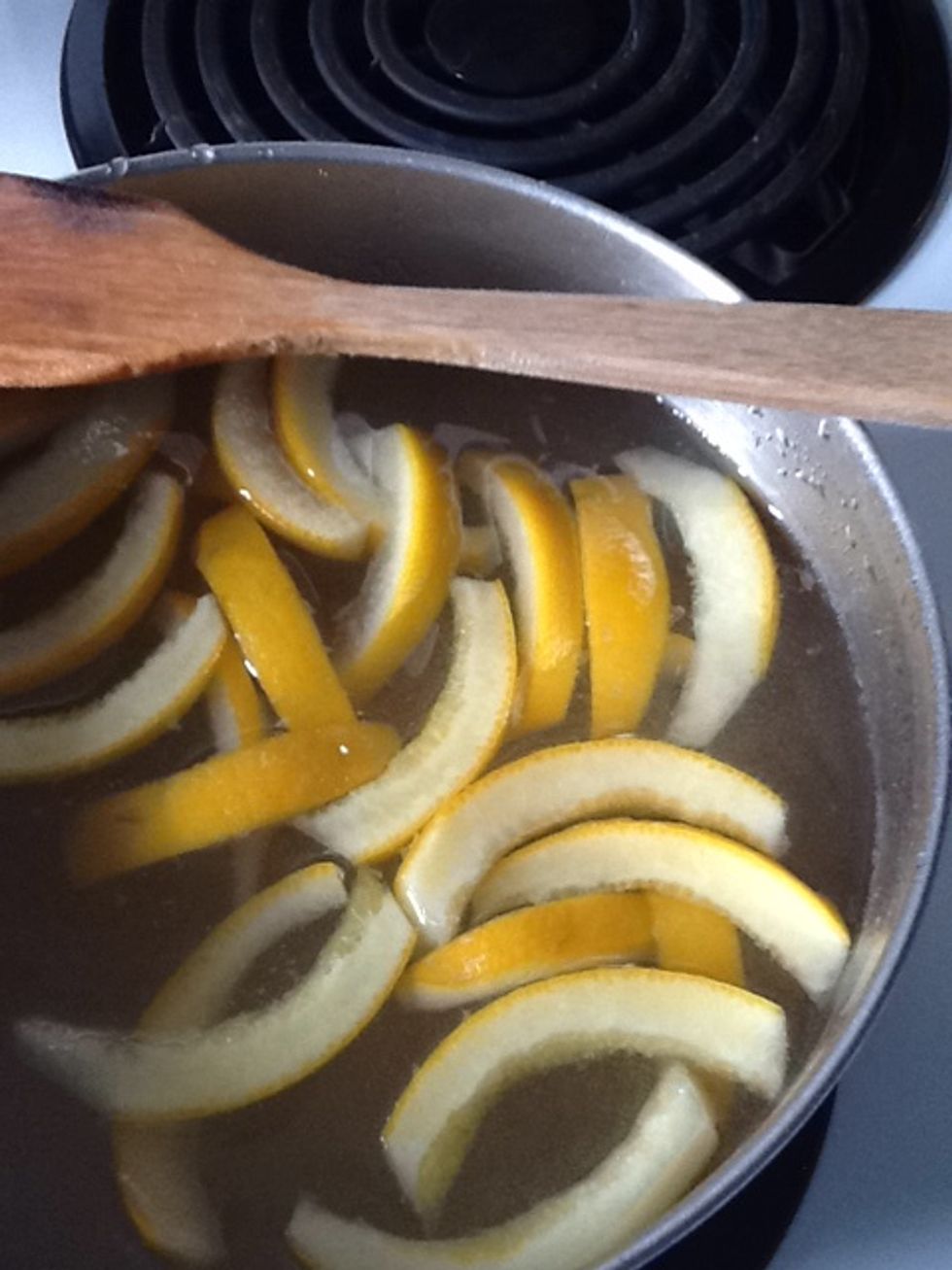 Combine equal parts sugar and water in the saucepan (about 3 times as much simple syrup as strips). Add orange peel and bring to a boil, stirring until sugar is dissolved. Boil until translucent.