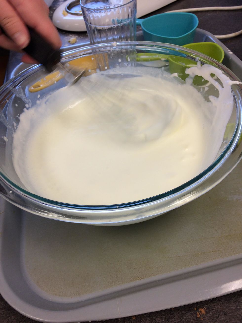Combine heavy cream and lemon juice and whisk