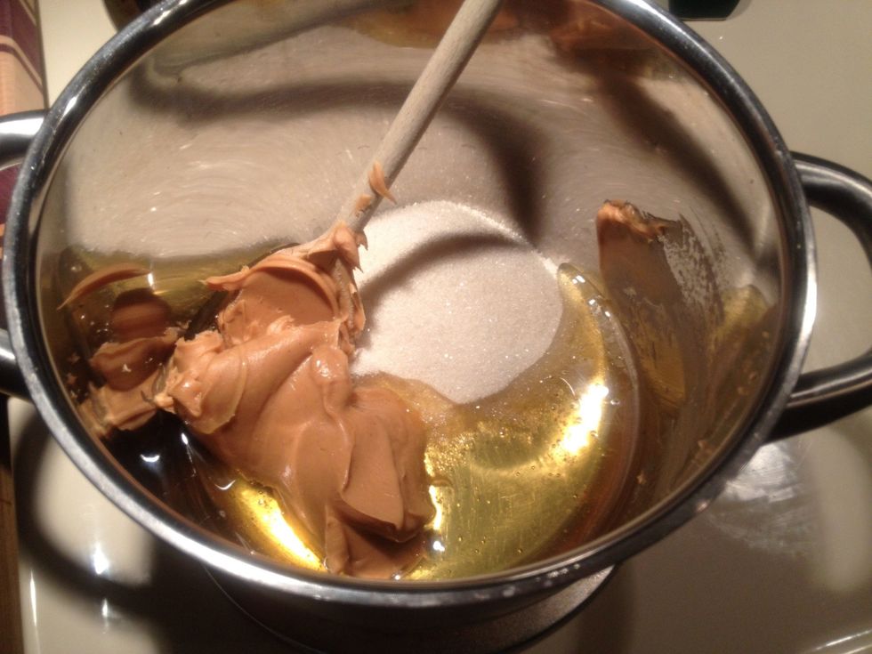 Combine honey, sugar and peanut butter in a small pan. Cook at medium high heat.