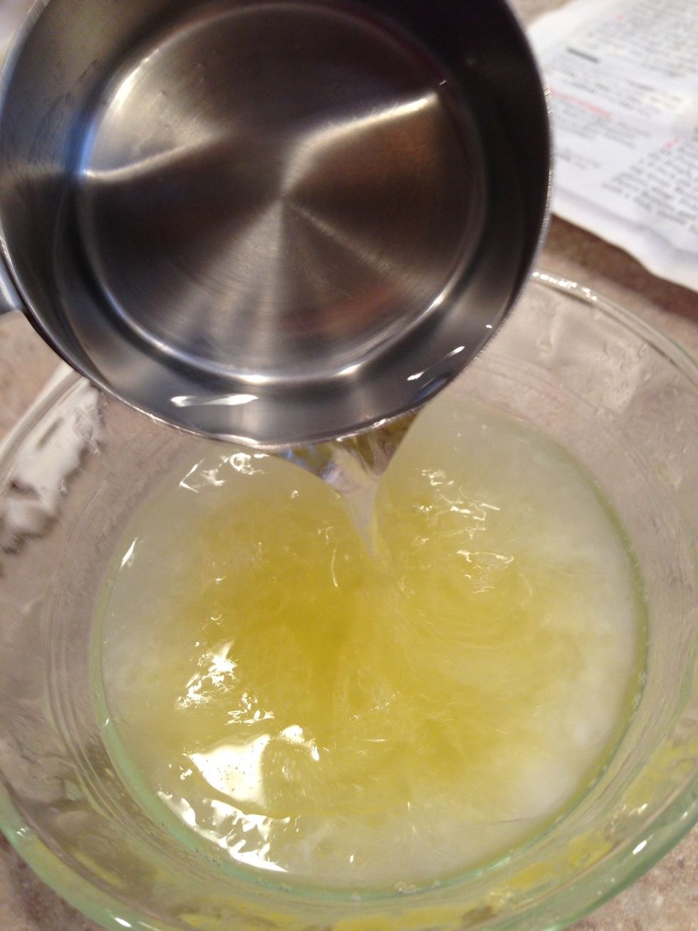 Combine melted butter and boiling water.