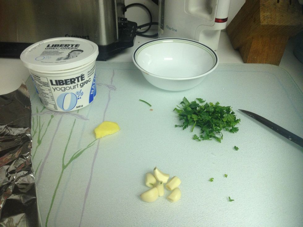 Combine minced garlic and whatever else you think would be good with the Greek yogurt. I'm also including minced ginger root and chopped parsley.
