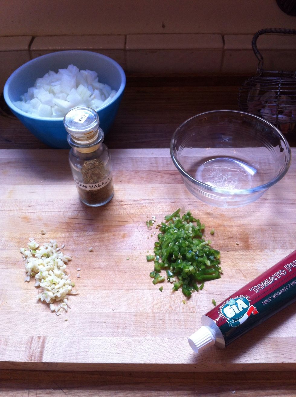 combine minced garlic, serrano, tomato paste, and garam masala into a small bowl.