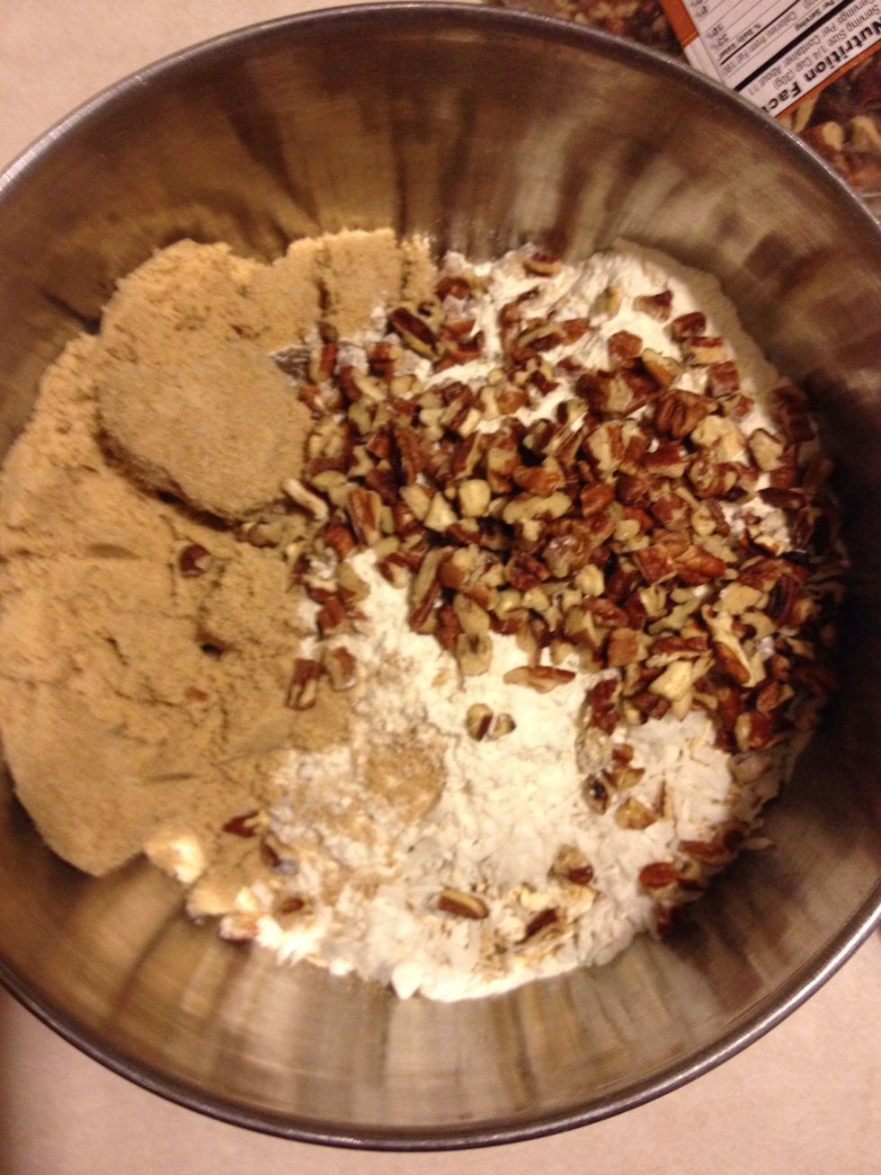 Combine oats, brown sugar, flour, coconut and pecans in a bowl.