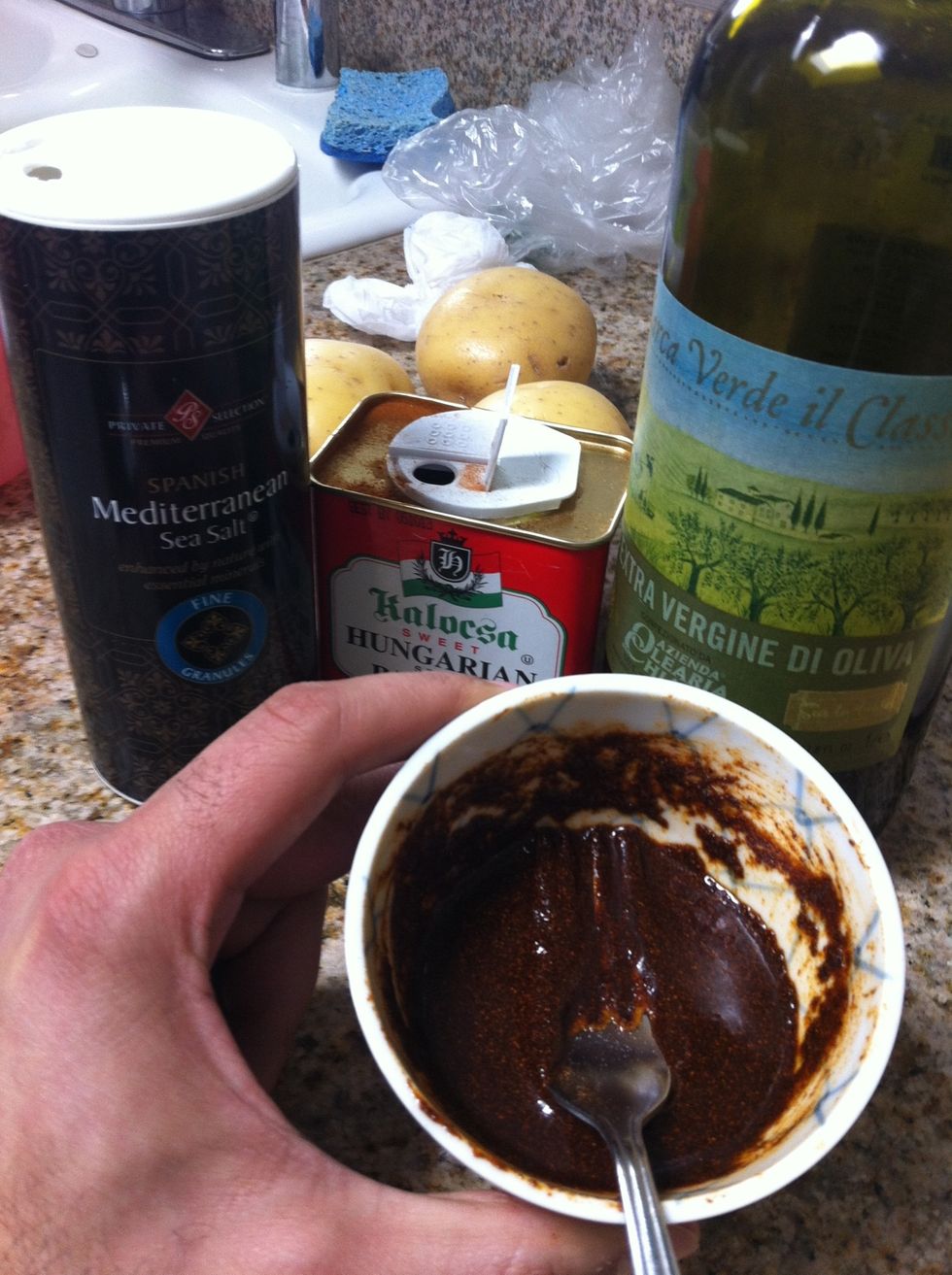 Combine olive oil and paprika into gloppy paste.