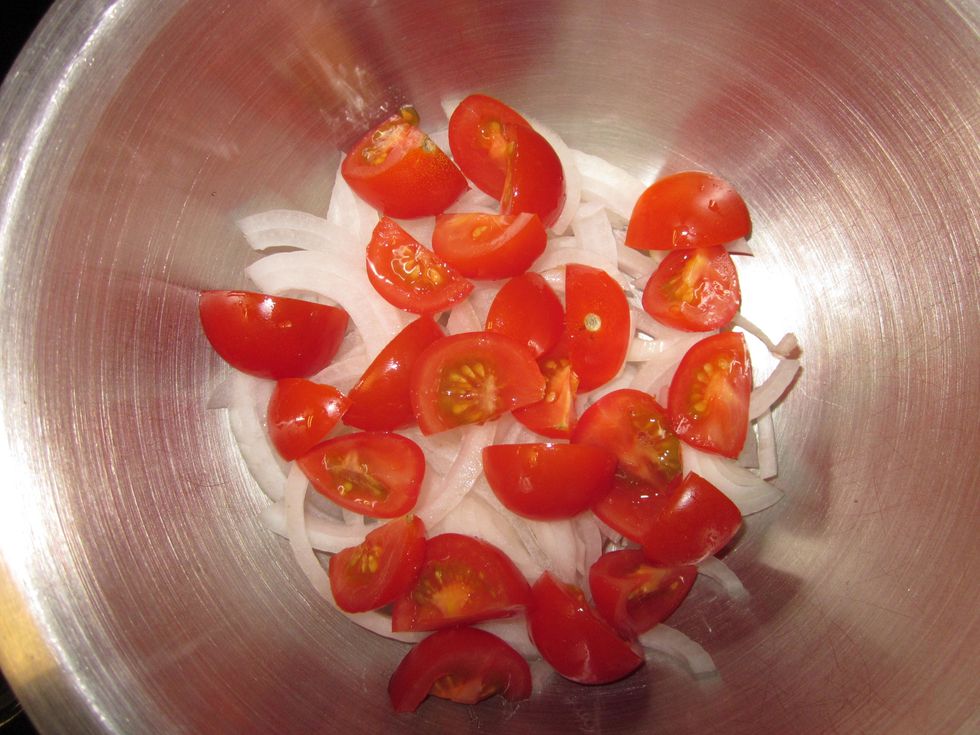 Combine onion slices and tomatoes in a separate bowl