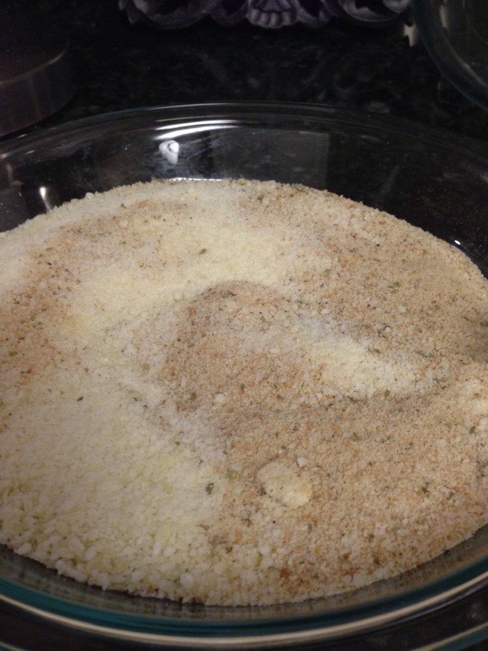 Combine Parmesan cheese and breadcrumbs in shallow plate. In another plate, combine beaten egg and water.