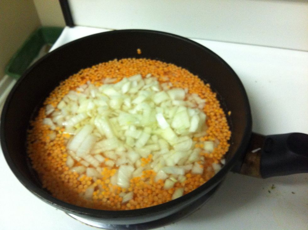 Combine red lentils, chopped onion, sage and water in a large frying pan and bring to boil on medium heat. Then reduce heat and continue stirring for 10-15 mins or until all the water is absorbed.