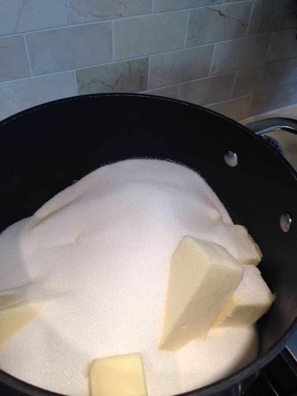 Combine sugar and butter and heat on medium. Allow butter to begin to melt, stirring occasionally to combine.