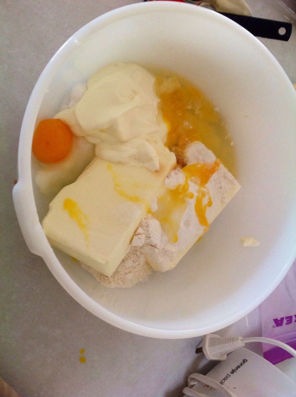 Combine the eggs, cream cheese, plain flour, sour cream, vanilla and sugar