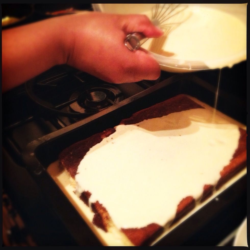 Combine the evaporated milk, sweetened condensed milk, cream, vanilla and rum and whisk gently until mixed. Pour the mixture over the cake.