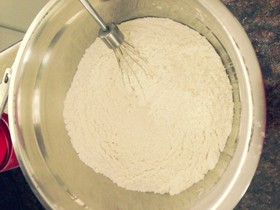 Combine the flour, baking soda, baking powder and salt with a whisk.