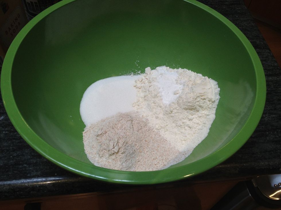Combine the flours, sugar, baking soda, baking powder and salt into a large mixing bowl. Use a whisk to blend.