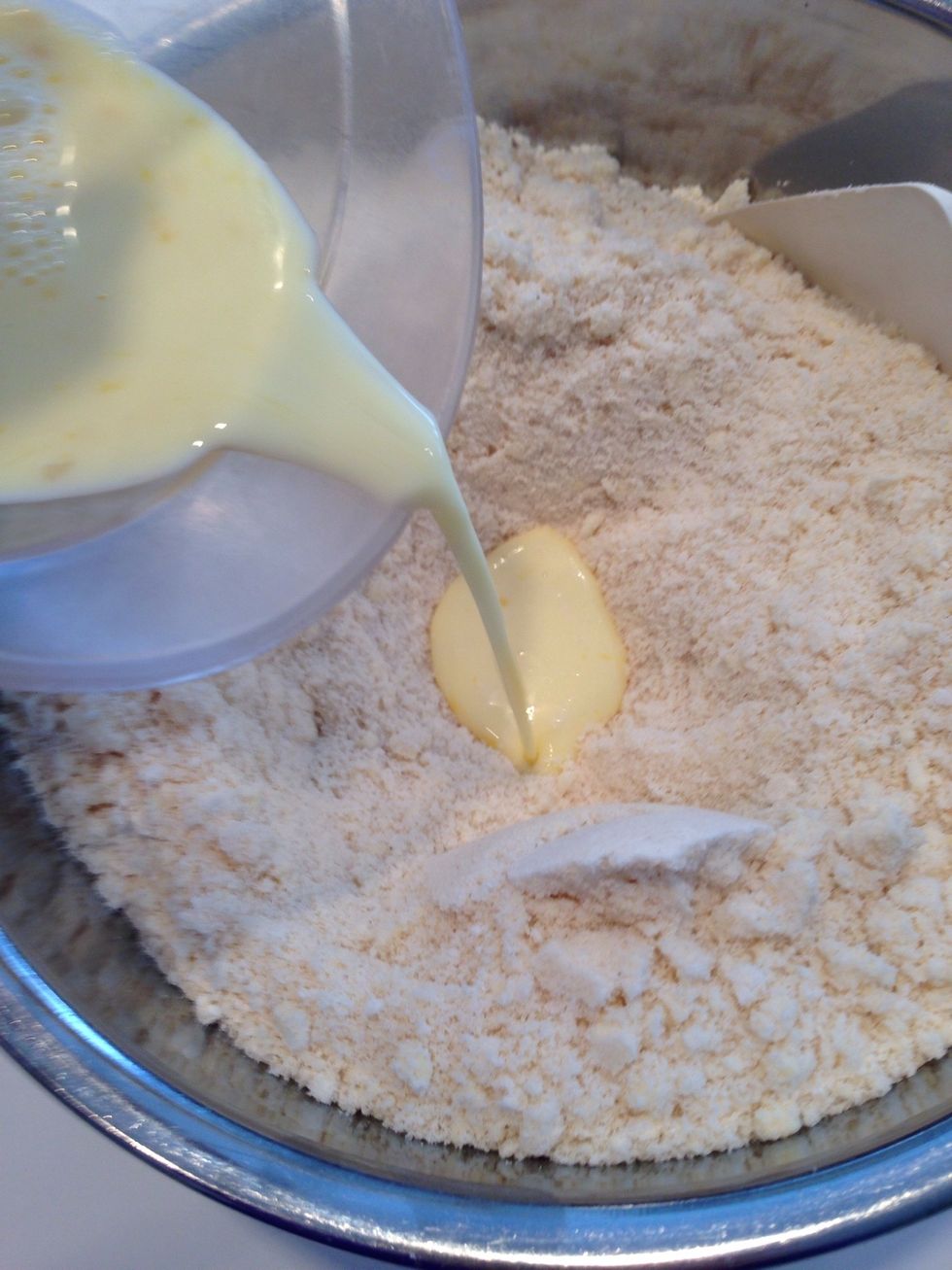 Combine the milk and eggs and pour into the bowl.