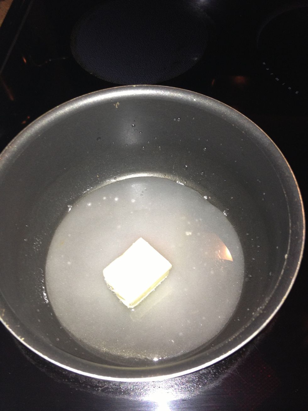 Combine the sugar, water and butter in a medium sauce pan and bring it to a boil while stirring.