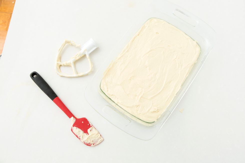 Combine the two cake layers by putting frosting in the middle, then frost the outside of the whole thing.