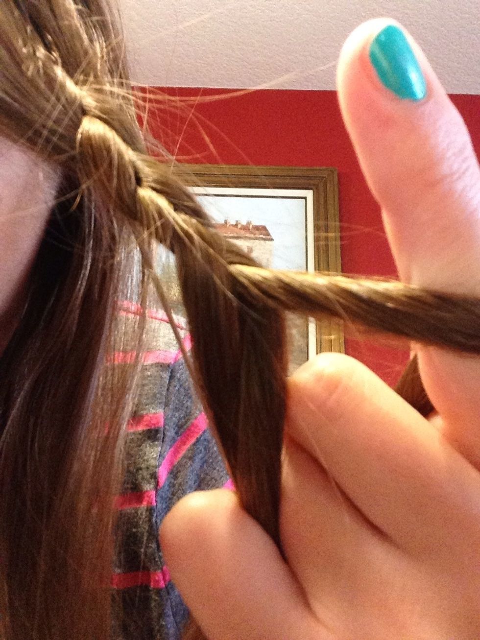 Combine the two outer strands of the braid so you now have two strands only