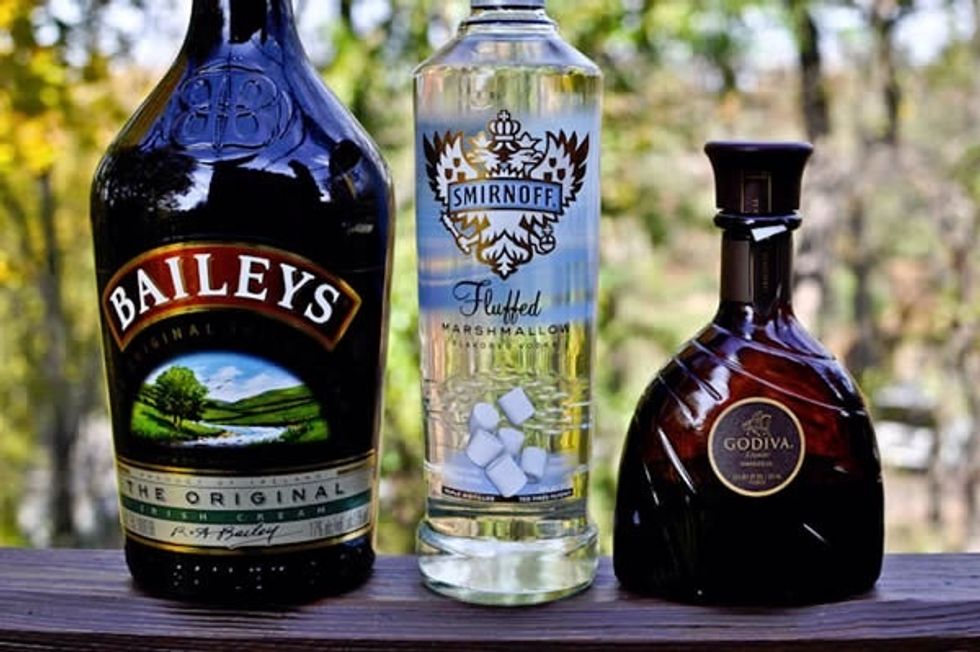 Combine the vodka, Baileys, Godiva and cream in a shaker (or water bottle with lid) with ice and shake for 15 seconds.