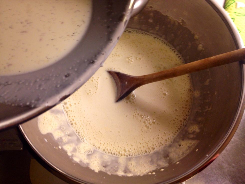 Combine the warm milk & cream with the eggs and sugar by pouring the milk mix on top of the eggs and sugar.