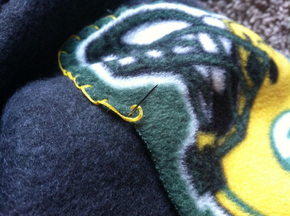 Come back up at the edge of the appliqu\u00e9.