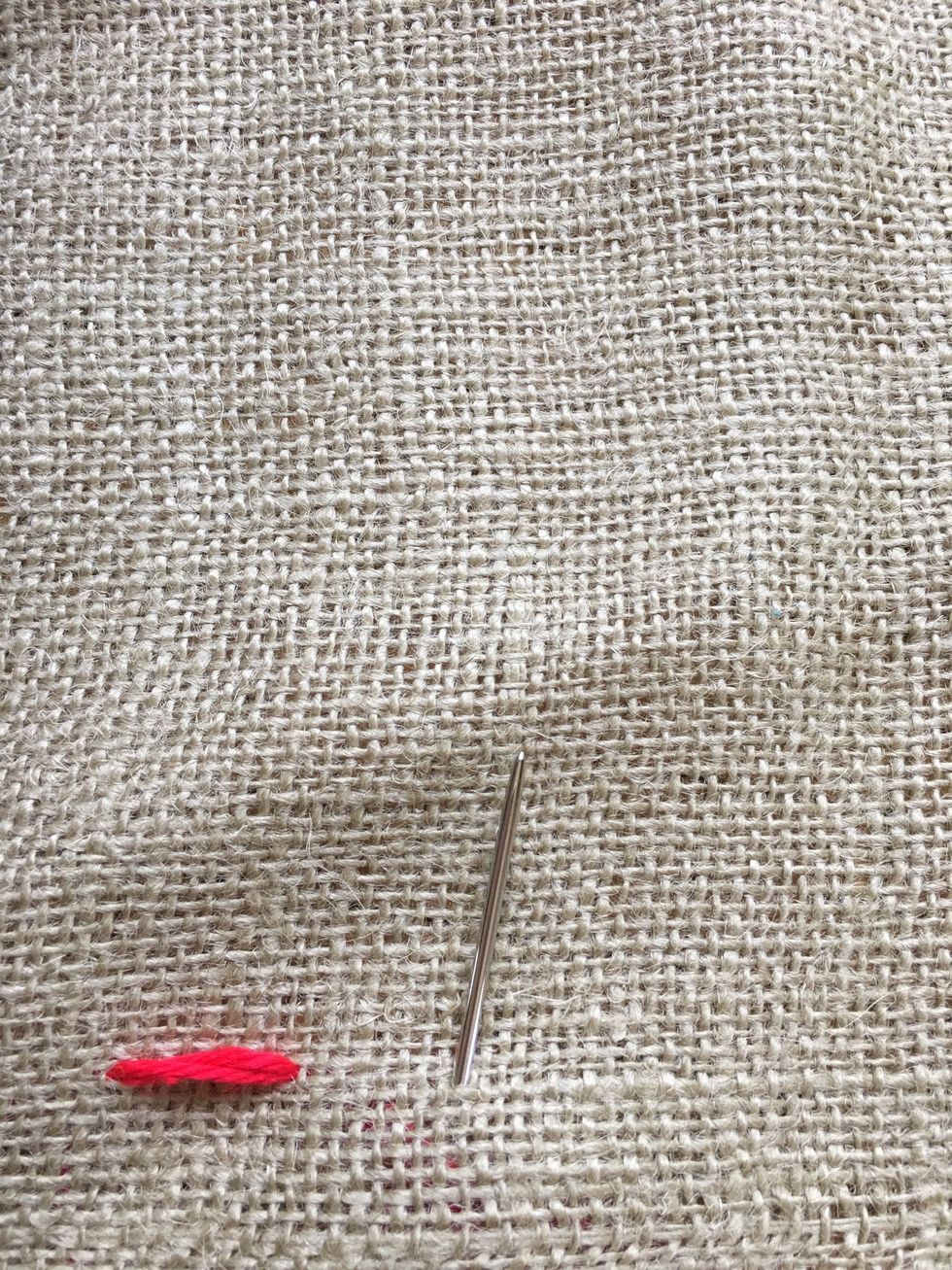 Come up from back. Keep the space the same as your first stitch.