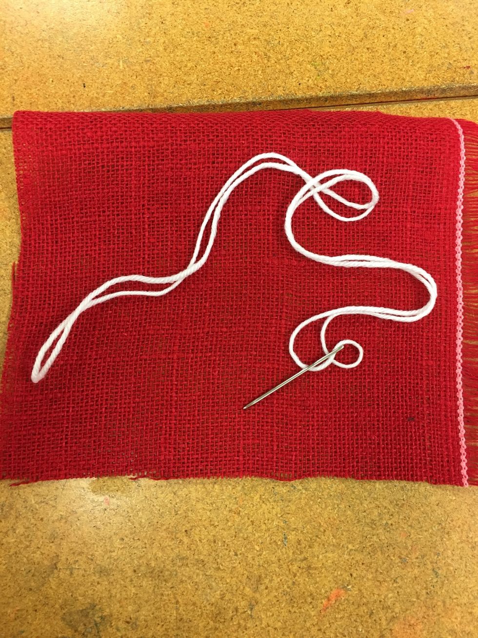 Come up from the back and pull your yarn all the way through.