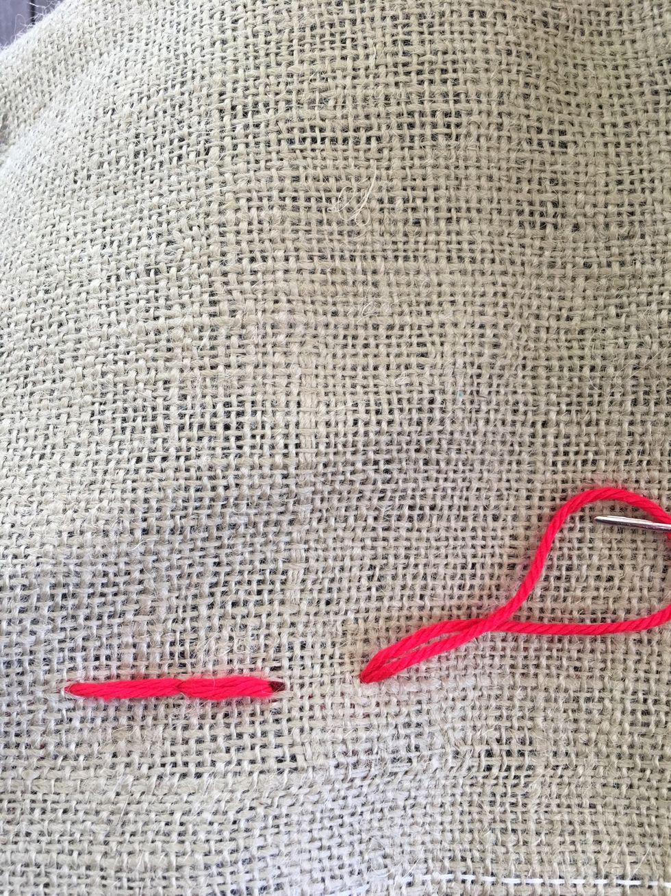 Come up from the back. Keep the space the same as your first stitch. Pull yarn all the way through.