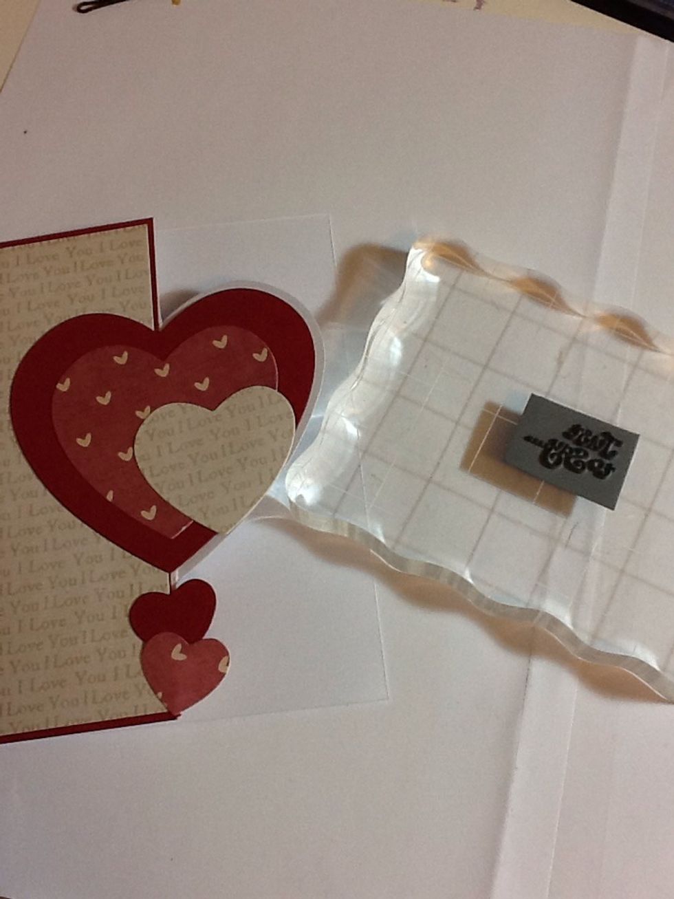 Coming to the end, pick a greeting (stamp, printed, freehand). I'm using a rubber stamp which I've stuck down to an acrylic block to use as the handle of the stamp (cheap pritstick is good to use)