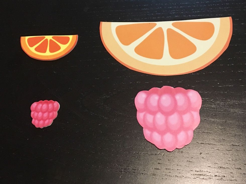 compare size and color of fruit pieces before and after shrinking. notice how the designs have become darker as the design colors have concentrated as they shrunk.