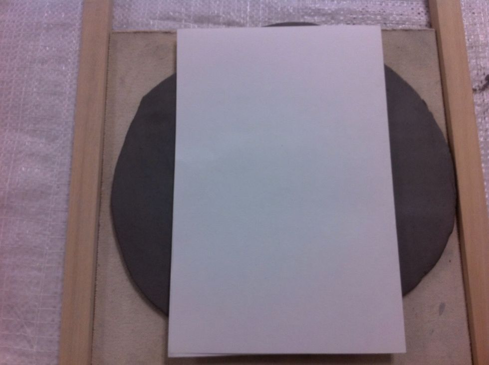 Compare the size of the slab to your template. If you need to, cut some of the extra and place it overlapping onto the short edge. Roll smooth.