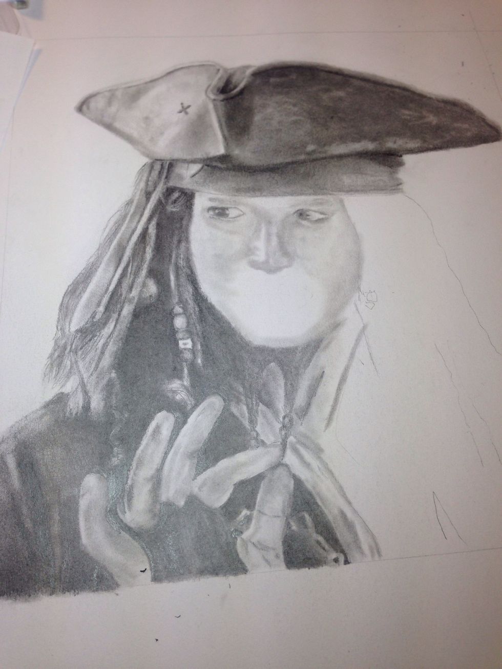 Complete drawing the other eye and start on his nose