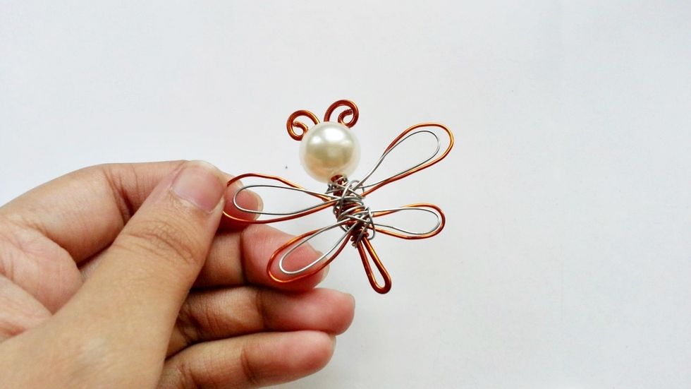 Complete the inner pattern of the wings. You can add more layers to the wings if you want to.