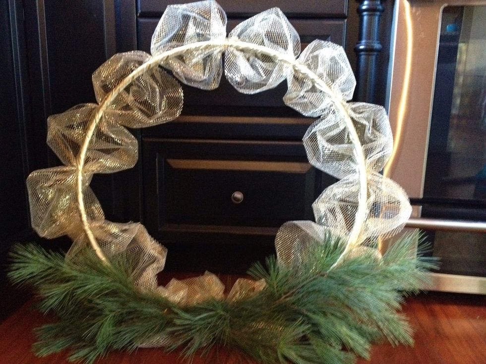 Complete the round. Too pouffy for my liking. I'll tame those poufs down by creating a gather in the middle of each one and secure it again by wiring it onto the hoop.