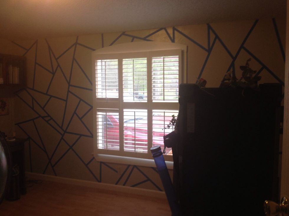 Completed painters tape. Make sure you press tape firmly on wall.