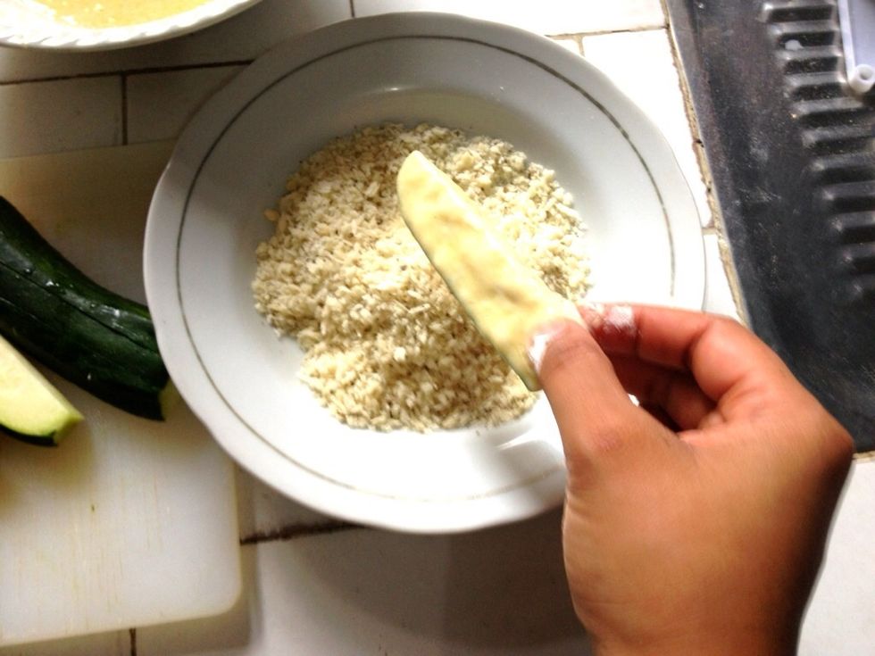 Completely coat the zucchini in panko breadcrumbs + dried herbs