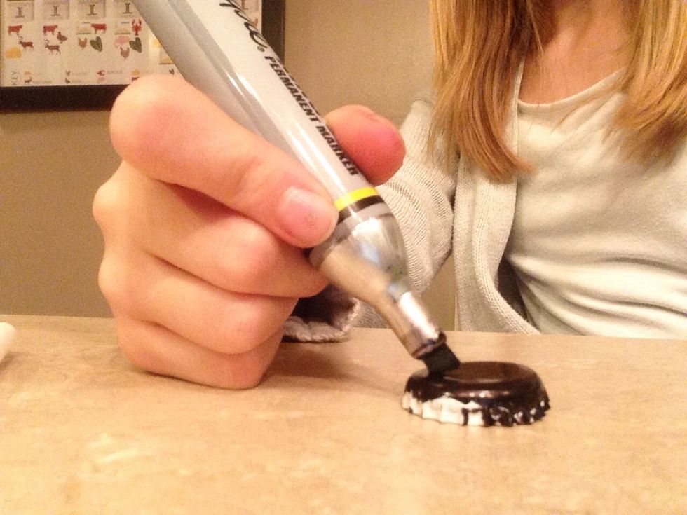Completely color the bottle cap black