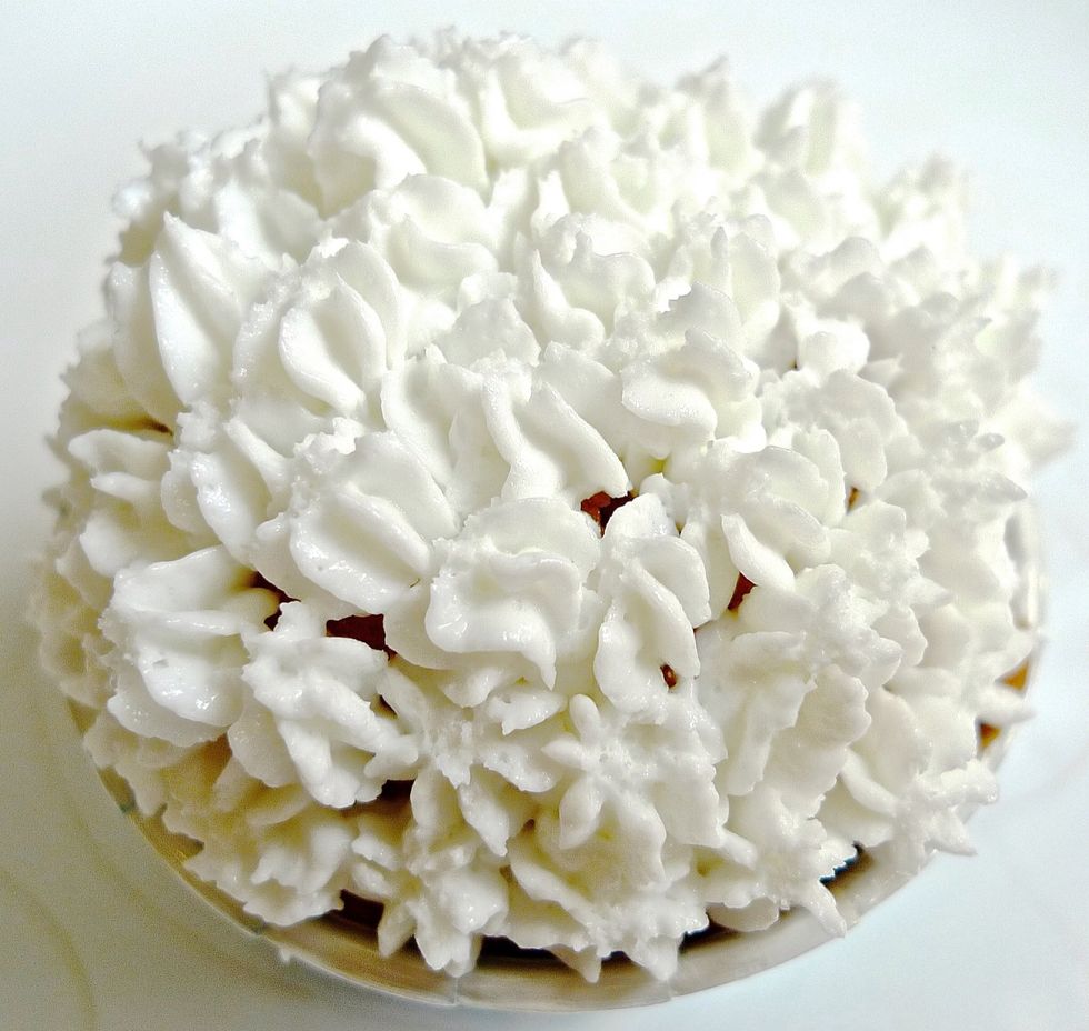 Completely cover the top of cupcake with the frosting.