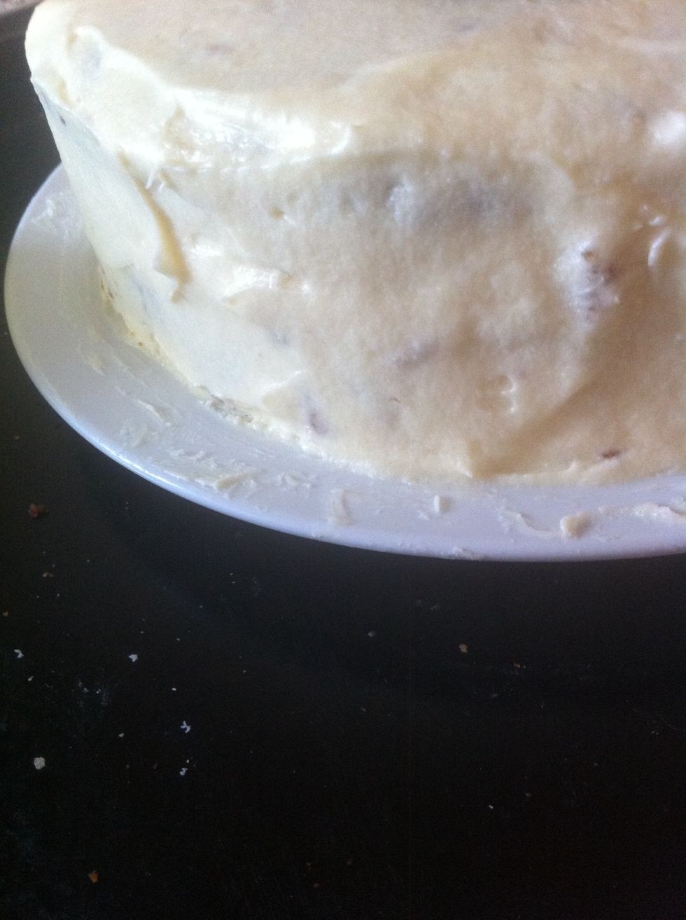 Completely frost your cake with looots of frosting ( keep a cup for decorations