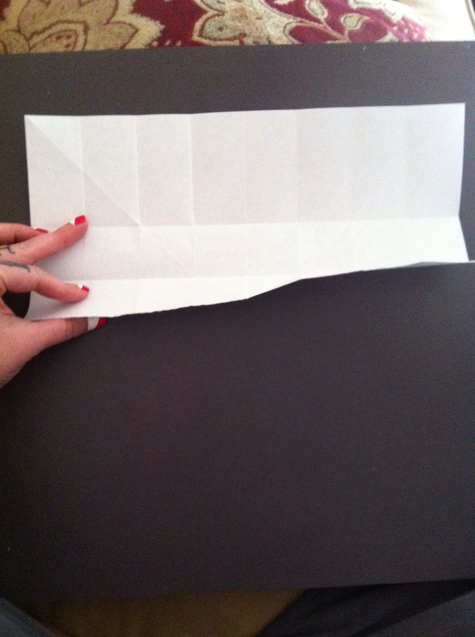 Completely unfold. Fold bottom edge to center crease. Fold top edge to center crease...