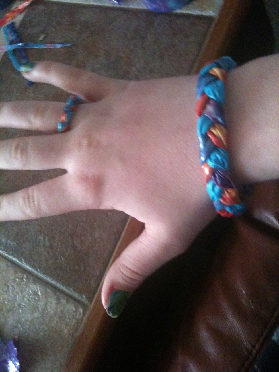 Congrats! Your bracelet is now finished. You can make a ring like this by cutting the strips in the beginning in fourths after folding in half. Continue like you did the bracelet. Size to your finger.