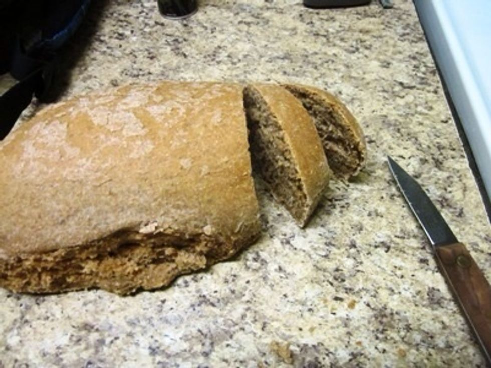 Congratulations! The bread is done! It is easier to cut when it is cool, but it is perfectly acceptable to cut it right away and enjoy a slice.  It tastes great, even without butter.