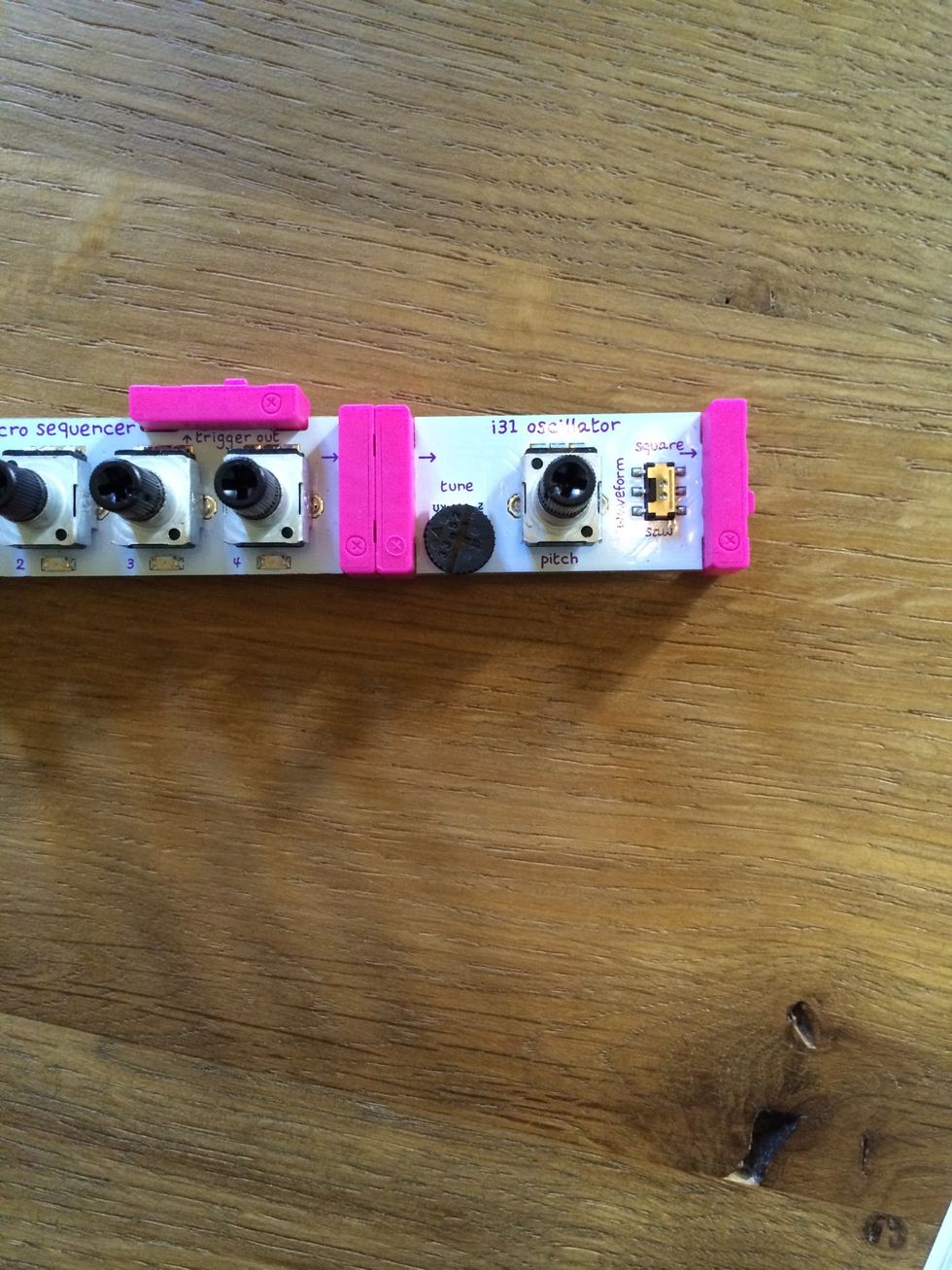 Connect another i31 oscillator module to the other side of the micro sequencer. This will control the pitch of the triggers and give them a voice!