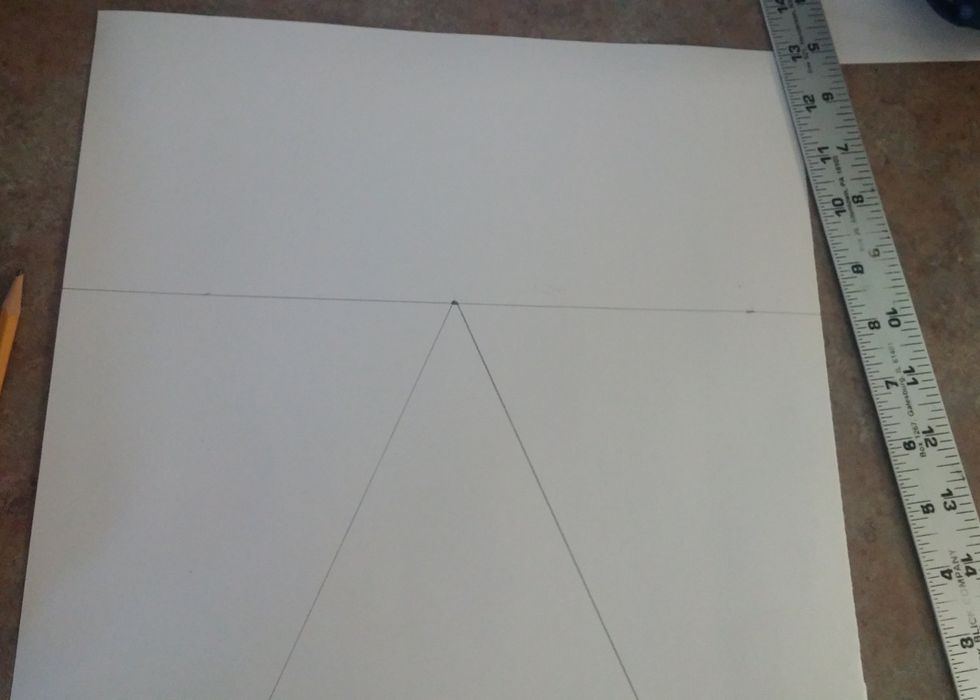 Connect each dot at the bottom of the paper to the vanishing point in the middle. This will be the lines of the railroad.