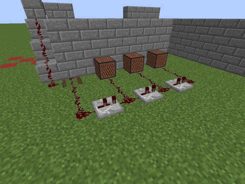 Connect note blocks using redstone to the redstone connecting to the doors so they sound when the door opens.