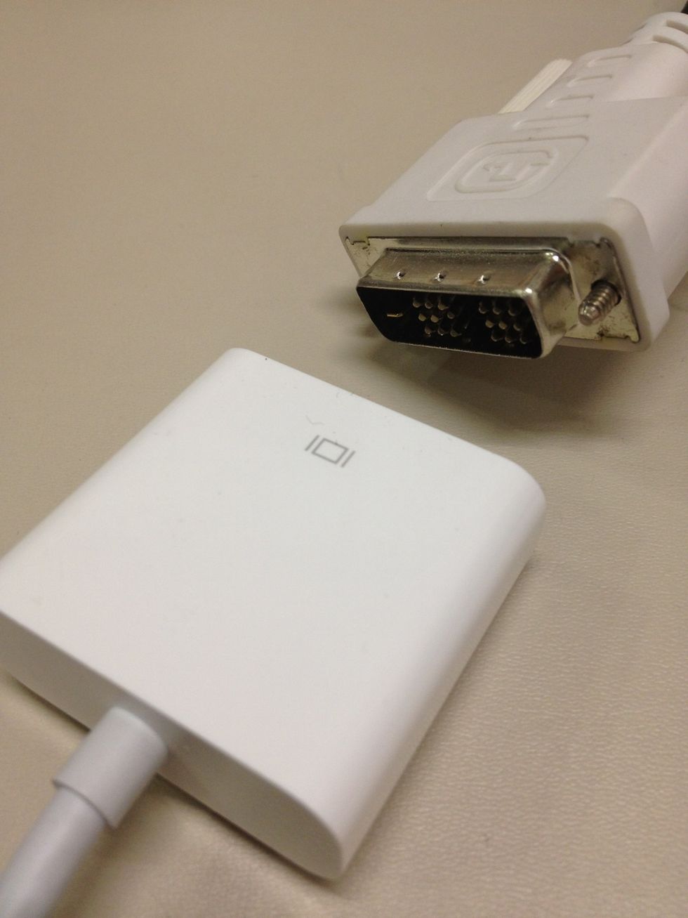 Connect one end of DVI cable to the Adapter