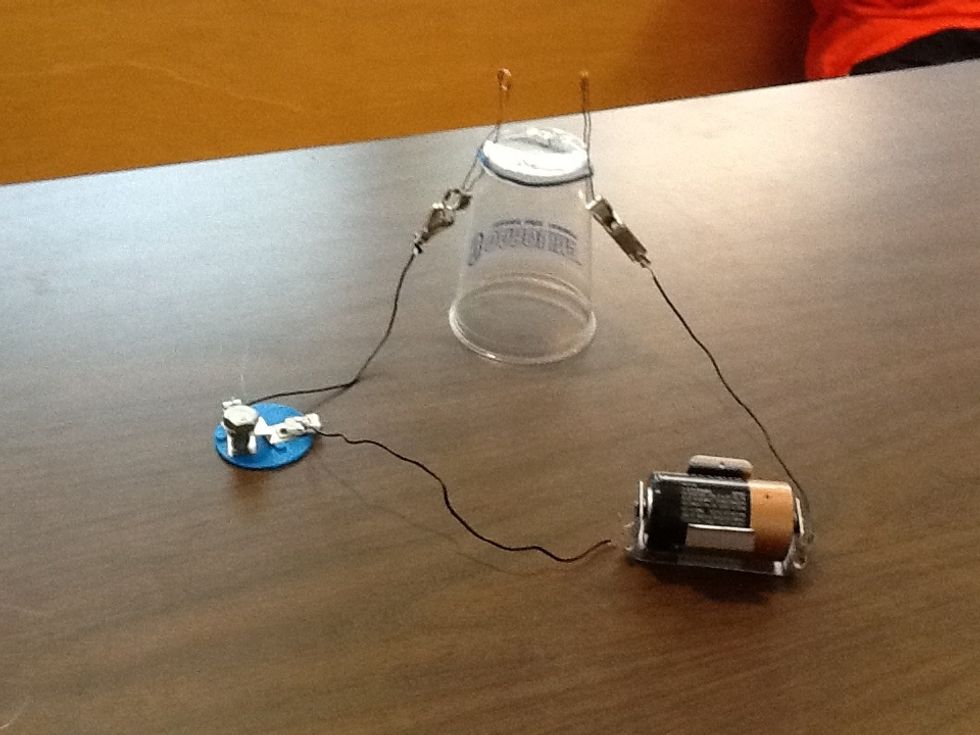 Connect the circuit as shown above. Connect one alligator clip to the battery holder, the battery holder to the switch, and the switch to the alligator clip.