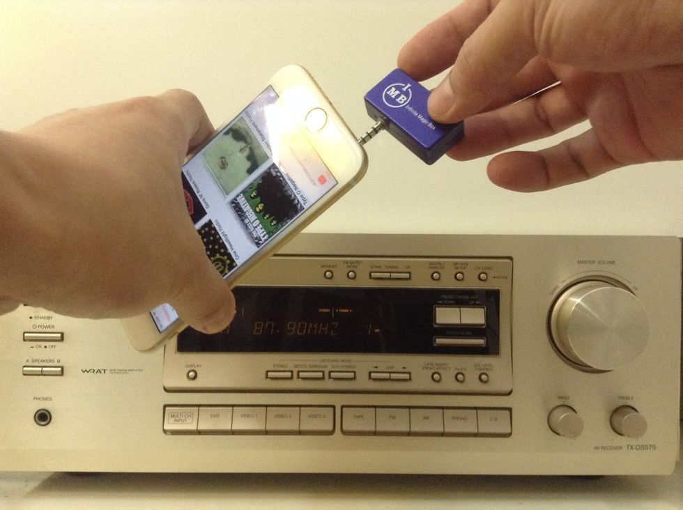 Connect the fm transmitter to the iPhone 6 headphone connector.