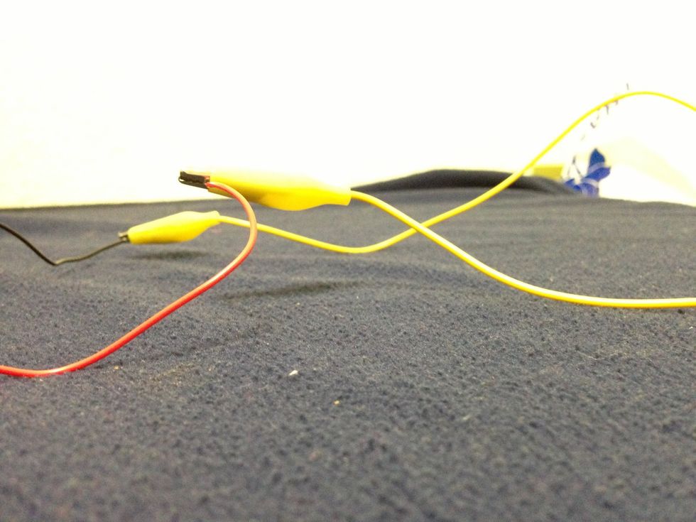 Connect the other end to another battery.