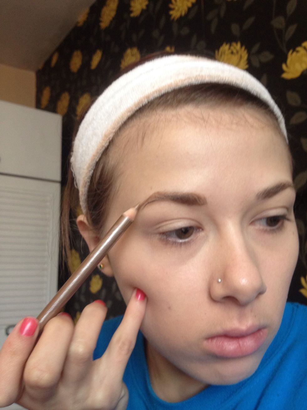 Connect the tail of the brow to the arch then lightly fill in sparse areas of the brow
