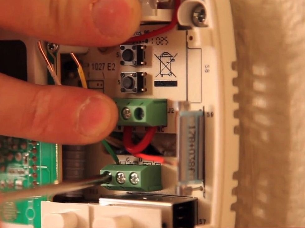 Connect the wires of the new thermostat to those inside the wall. If you have any concerns which wires to connect, refer to the manufacturer-issued installation instructions.